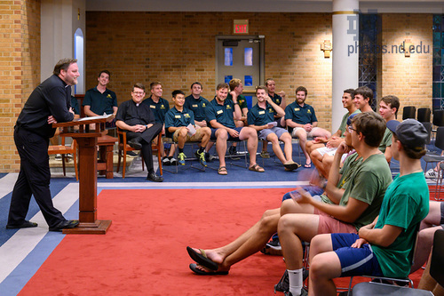 Fr. Chris speaks to new first year residents during an orientation event